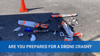 Image of a crashed drone with a safety cone next to the aircraft remains