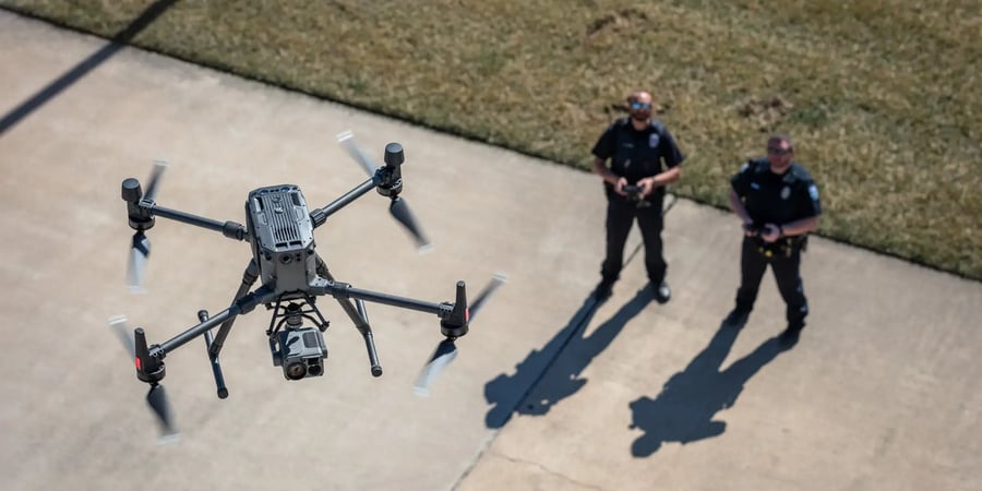 Two police officers operating an enterprise drone